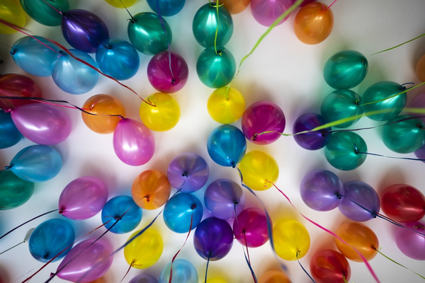 Balloons image by luca upper via unsplash